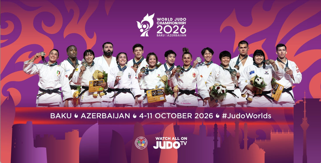 A group of judoka in white uniforms stand with medals, trophies and flowers against a purple and orange graphic backdrop.